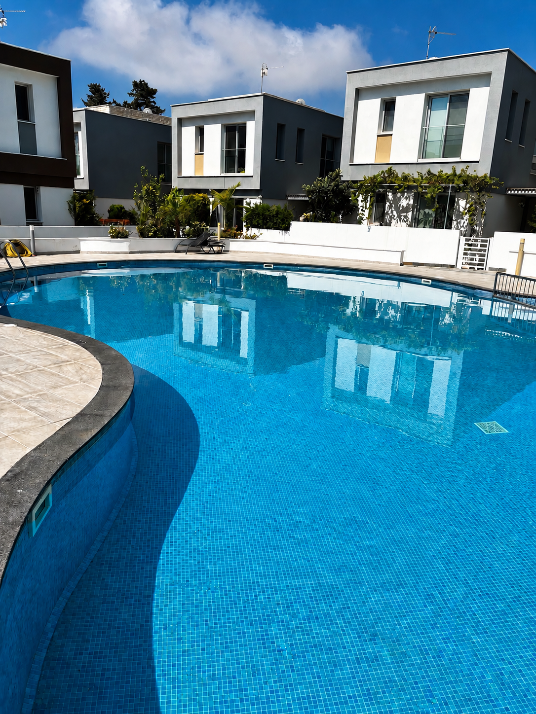Swimming pool and modern residential homes at Rose Gardens